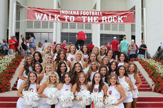 The Red Steppers pose outside Memorial Stadium.